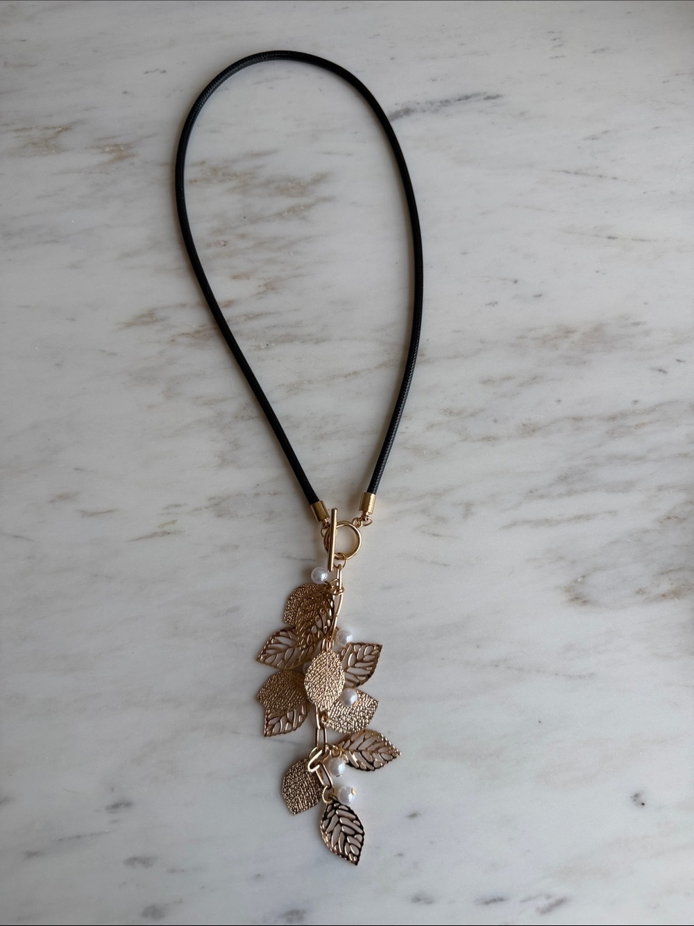 Gold Metal Leaf Cascade Pendant Necklace with Black Cord- Dainty , Feminine - Picture 5 of 5